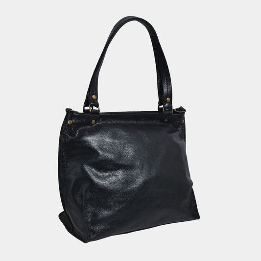 Onyx black butter leather bag on a light gray background