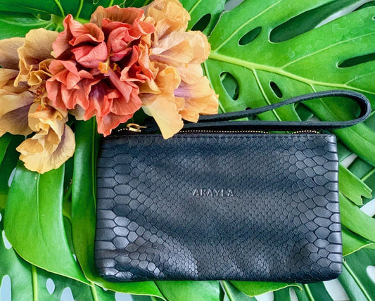Mini Clutch In Python Embossed Calfskin Leather with 'ARAYLA' branding on green leaves
