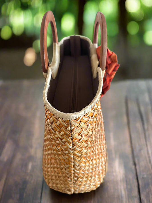 Handwoven Lauhala handbag side view featuring the bag zipper.