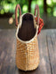 Handwoven Lauhala handbag side view featuring the bag zipper.