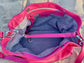 Hibiscus pink bag inside view with grey lining and an inside zipped pocket.